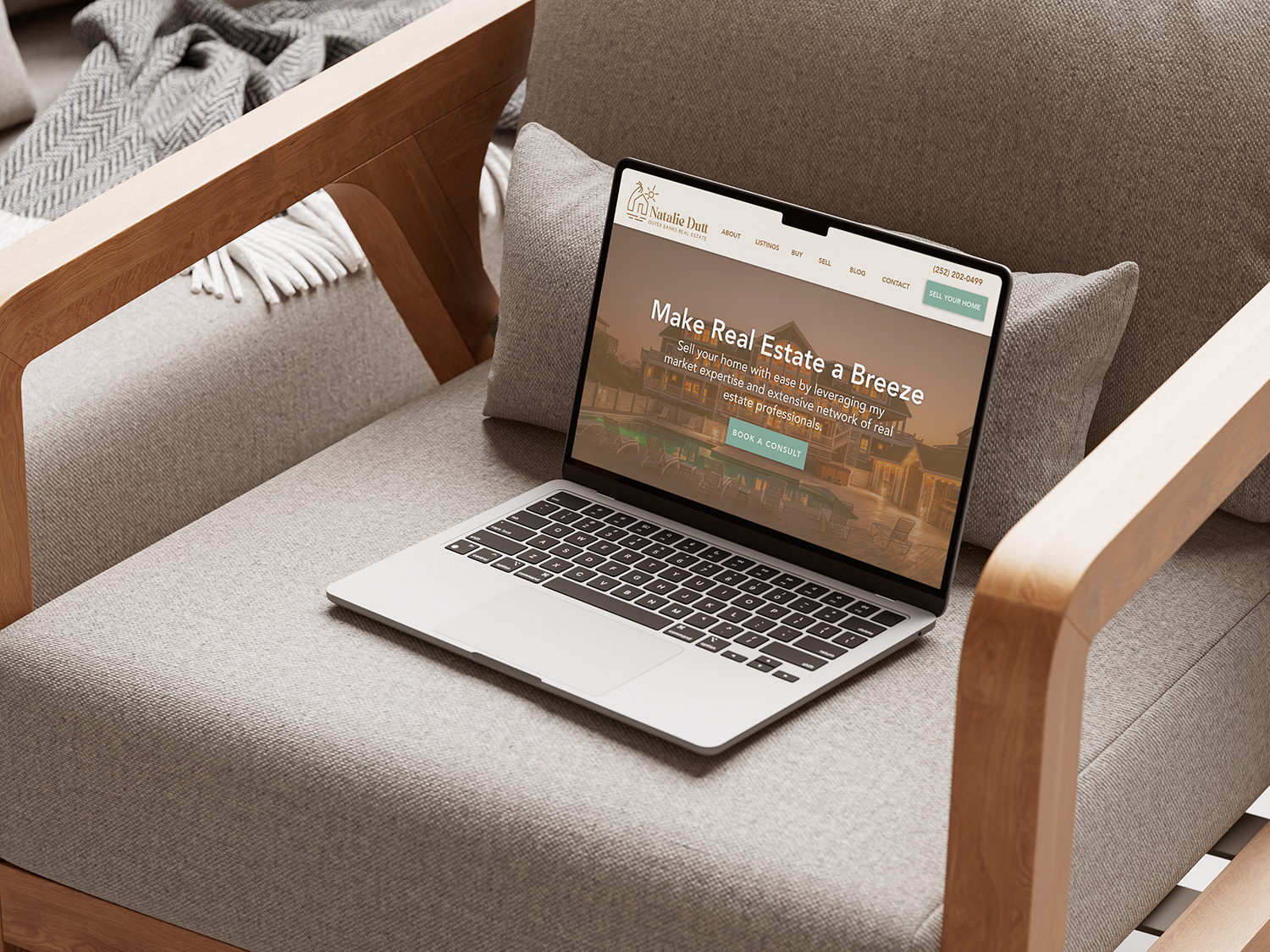 Natalie Dutt Real Estate brand shown on a laptop